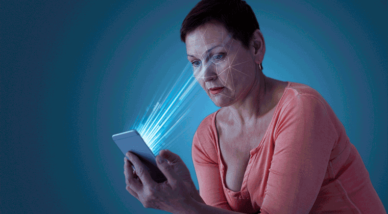 Uma mulher segurando um tablet com luz azul saindo dele
