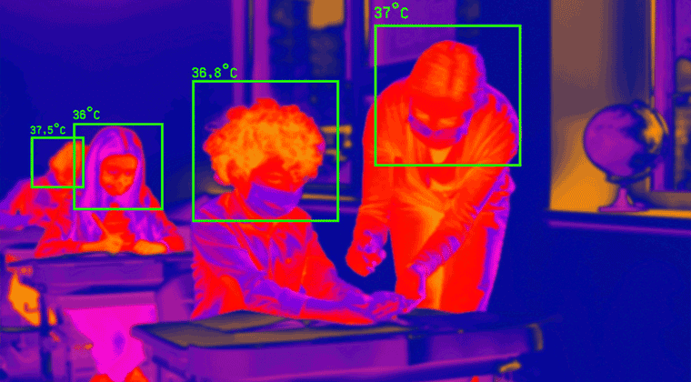 Um homem e uma mulher sentados à mesa vistos por uma camera térmica